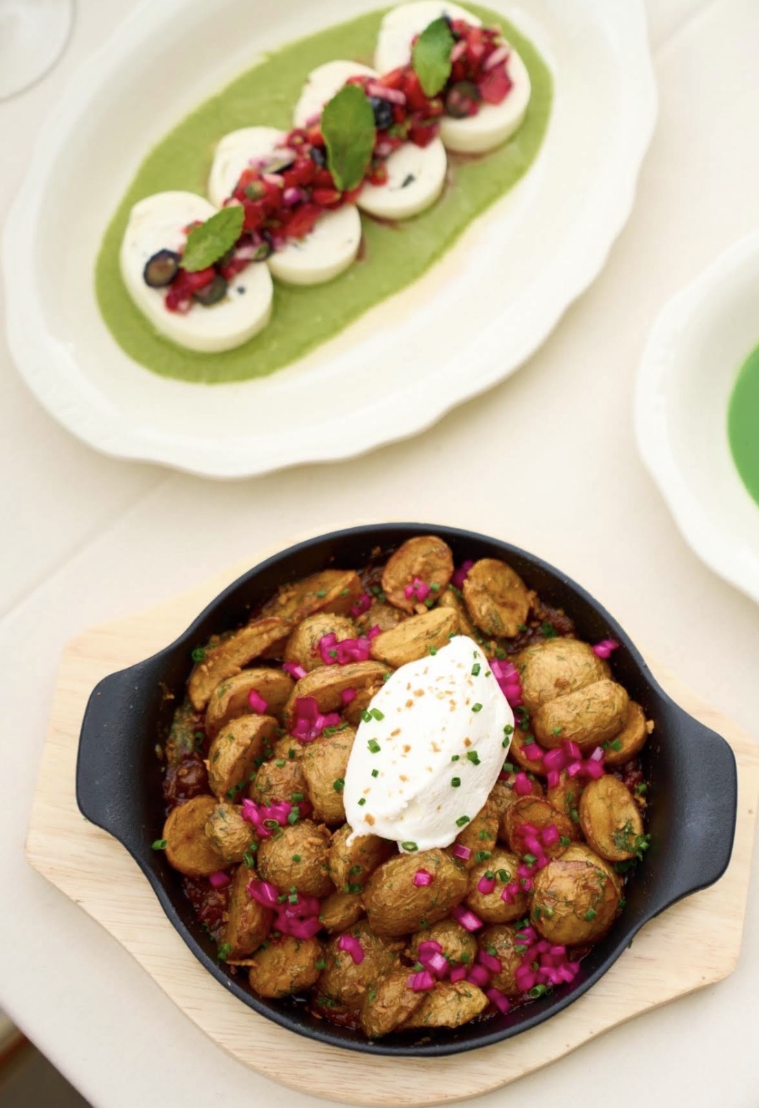 Nadugi with berry salsa and a skillet of odjakhuri potatoes
